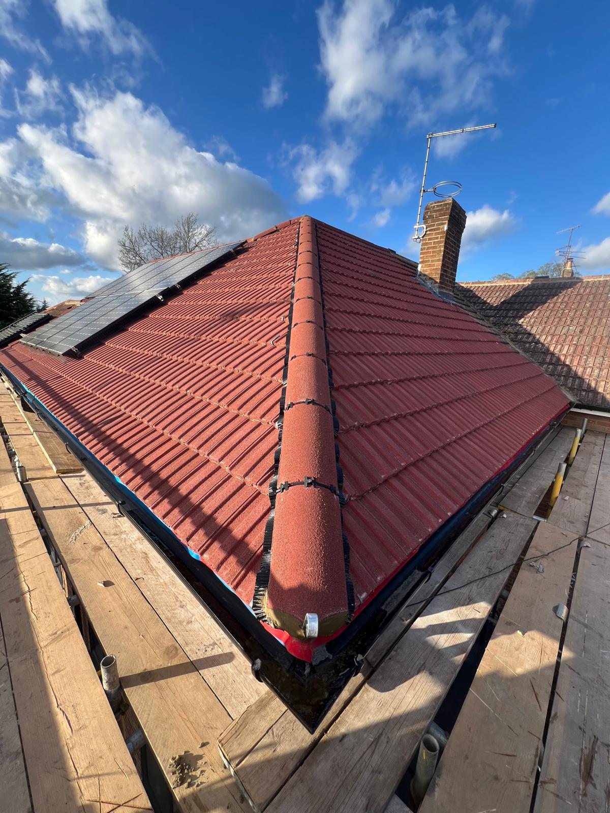 Red Tile Re-roof with Solar — roofing work in the South