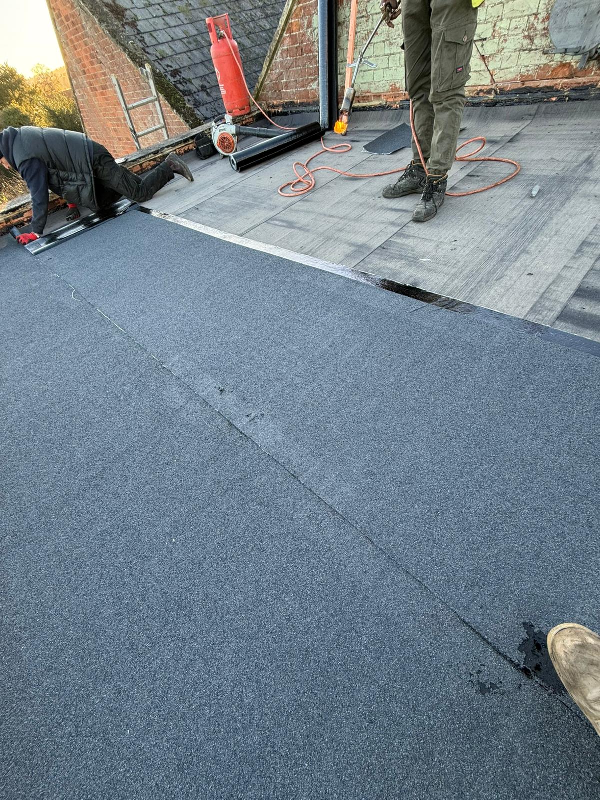 Large Felt Flat Roof Overlay — roofing work in the South